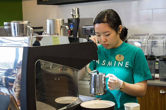 Jenny Wong, Student Tea Sommelier preparing beverages for a Jasmine Tea Bar customer
