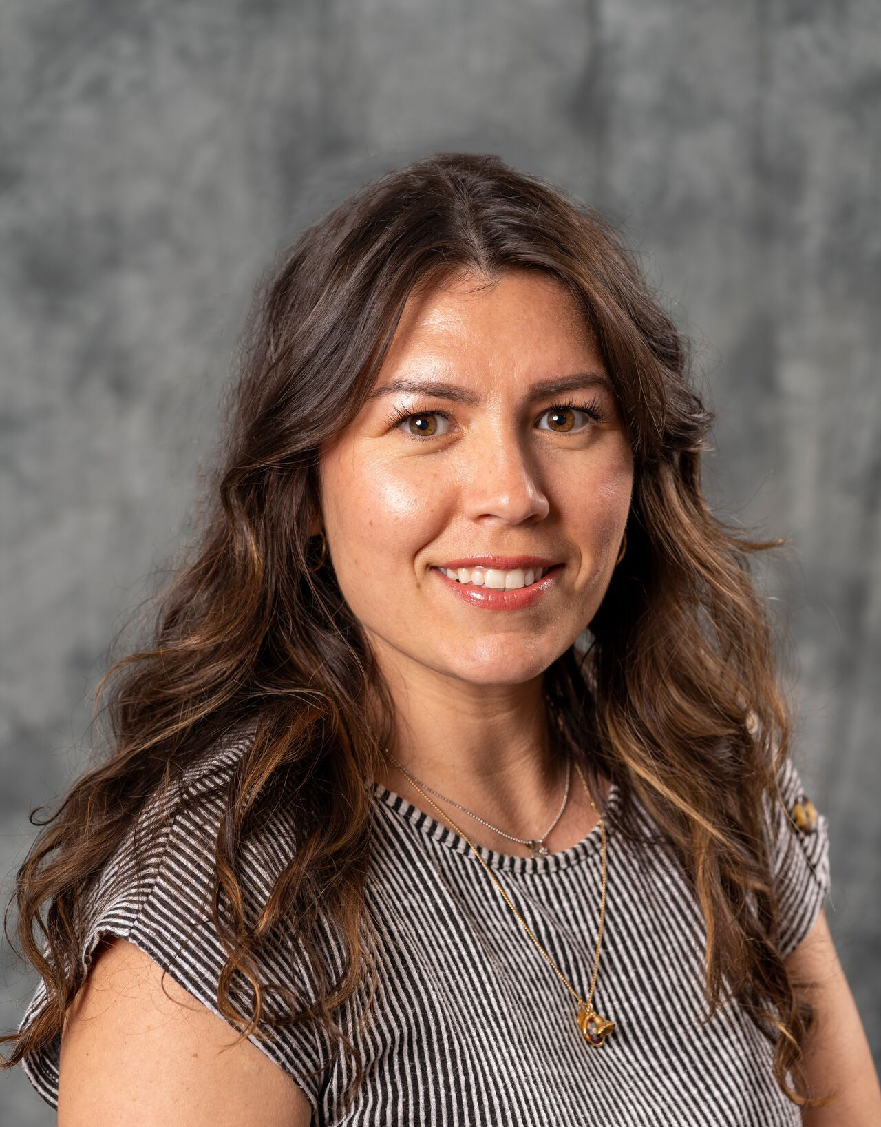 Danielle Belmonte, wearing a gray sweater 