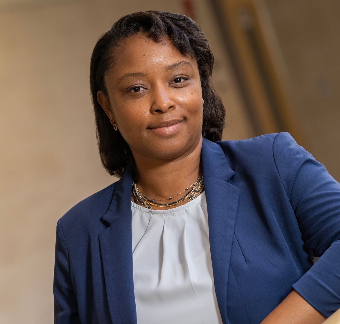 Bonita, London, wearing a blue suit jacket and white shirt