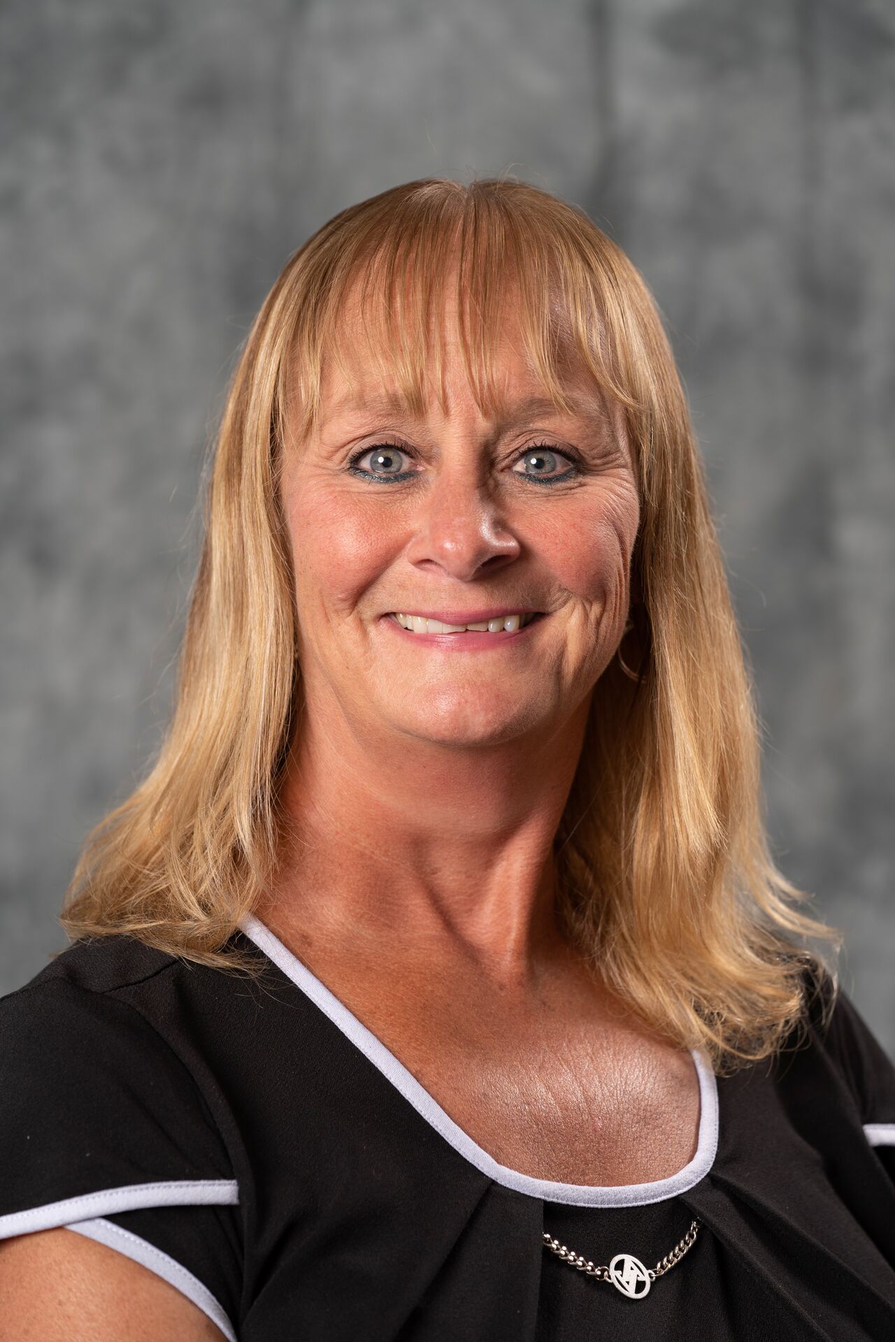 Laura Stevenson, with shoulder-length blonde hair, smiling