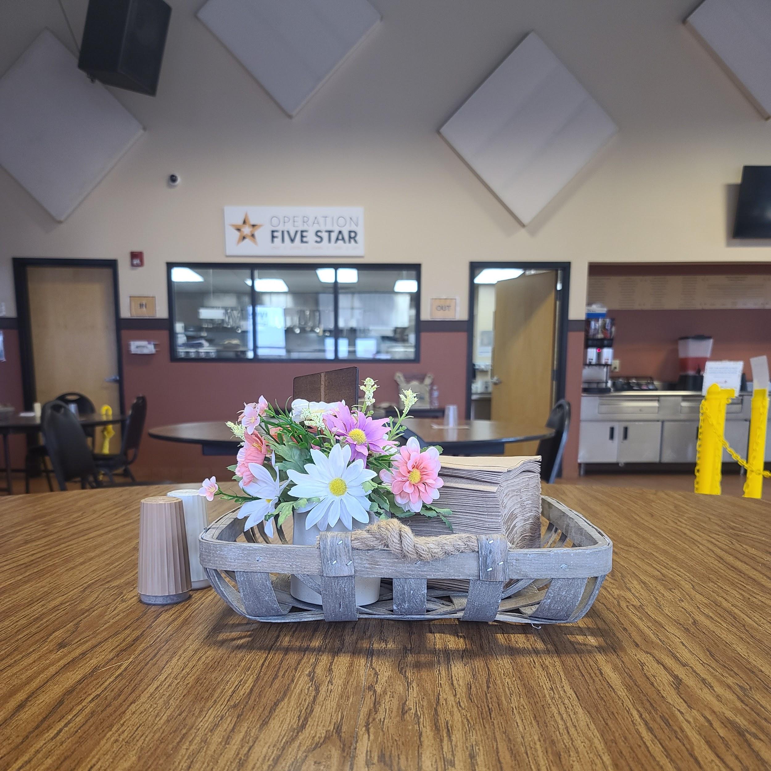 Bajaj 1 Schenectady City Mission flowers on a table