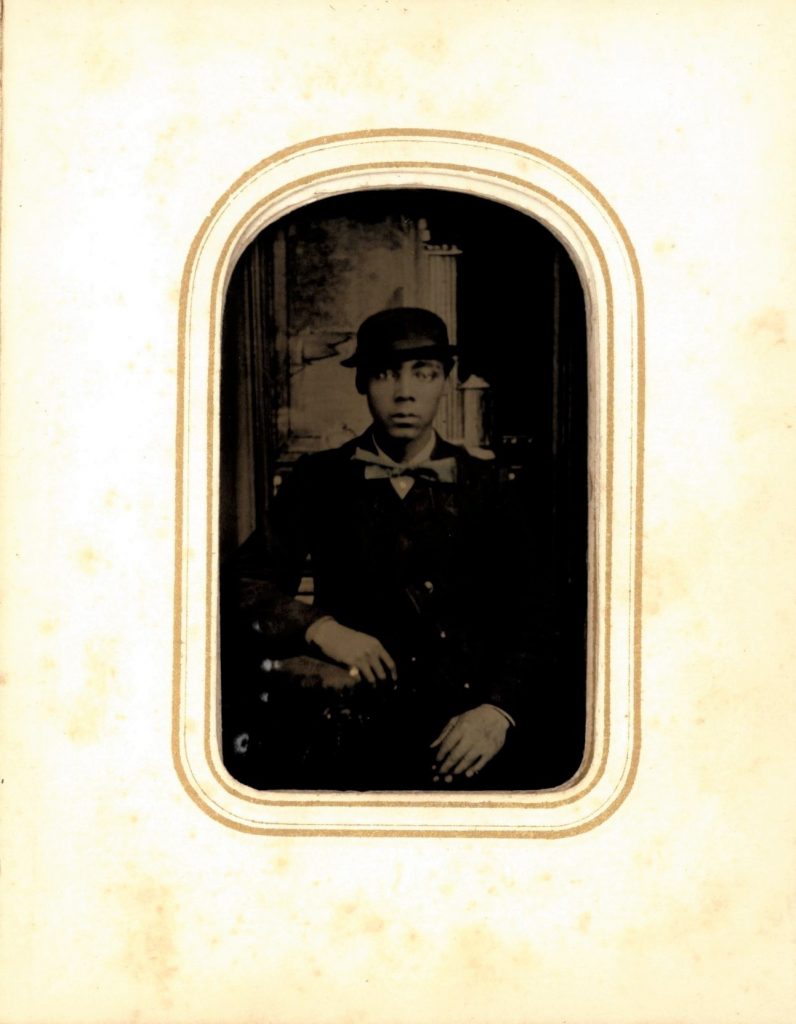 African American man wearing a hat pictured in a 19th-century tintype portrait.
